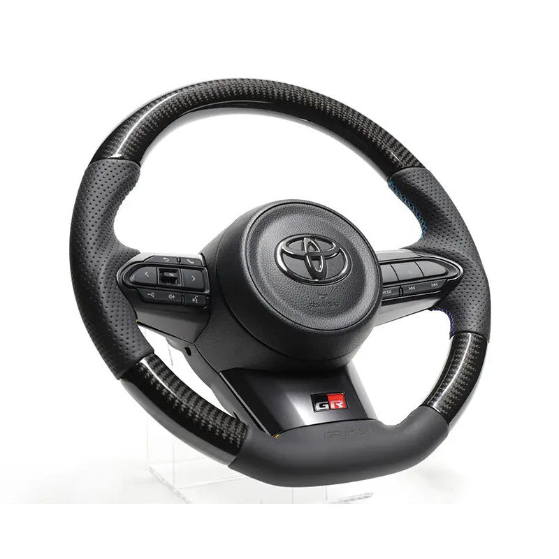 Carica immagine in Galleria Viewer, Volante GReddy in Carbonio Nero con Cuciture Tricolori per Toyota Yaris GR
